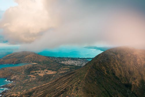 Brown and Green Mountains Under White Clouds