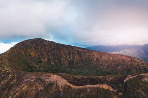 Brown and Green Mountain Under White Clouds