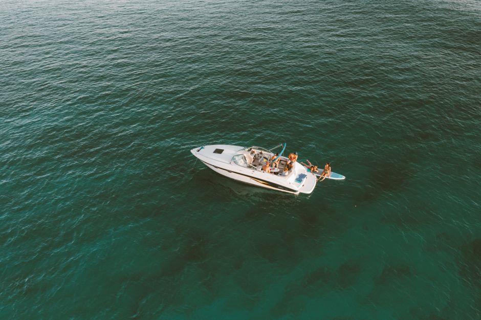 Stunning Ohana Yachts Sport Fishing & Luxury Charters Review: The Ultimate Oahu Ocean Adventure Review 2026 - Aerial view of a boat surrounded by blue ocean waters, capturing paradise vibes in Hawaii.