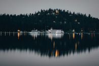 White Boat on Body of Water during Night Time