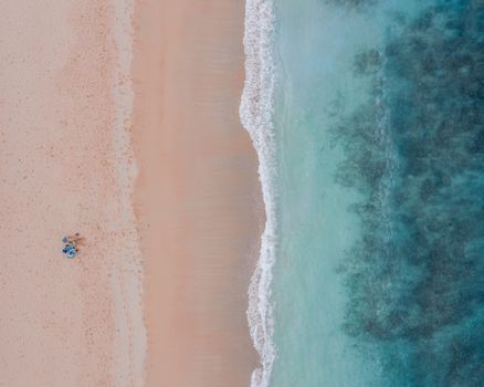 A serene aerial view of Pupukea Beach, showcasing turquoise waters and sandy shores, perfect for a tropical escape.