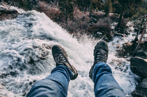 Free A Person Feet Hanging over a Cliff Stock Photo