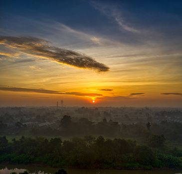 Beautiful sunset view over rural Banten with dramatic skies and lush greenery.