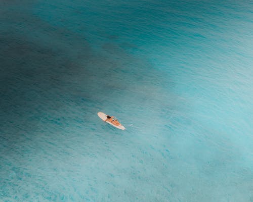 White and Blue Boat on Blue Sea