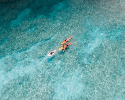 Drone captures kayakers on crystal blue waters in Pupukea, Hawaii.