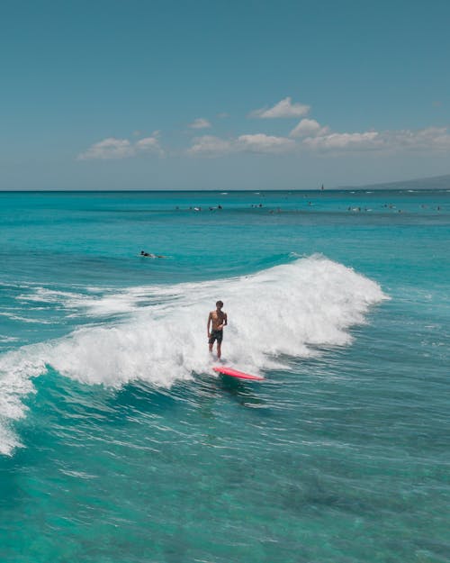 Man Surfing on Sea Waves