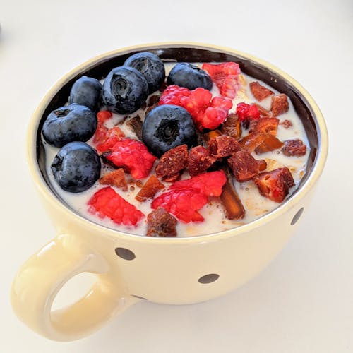 Big cup of delicious yogurt with fresh berries for breakfast