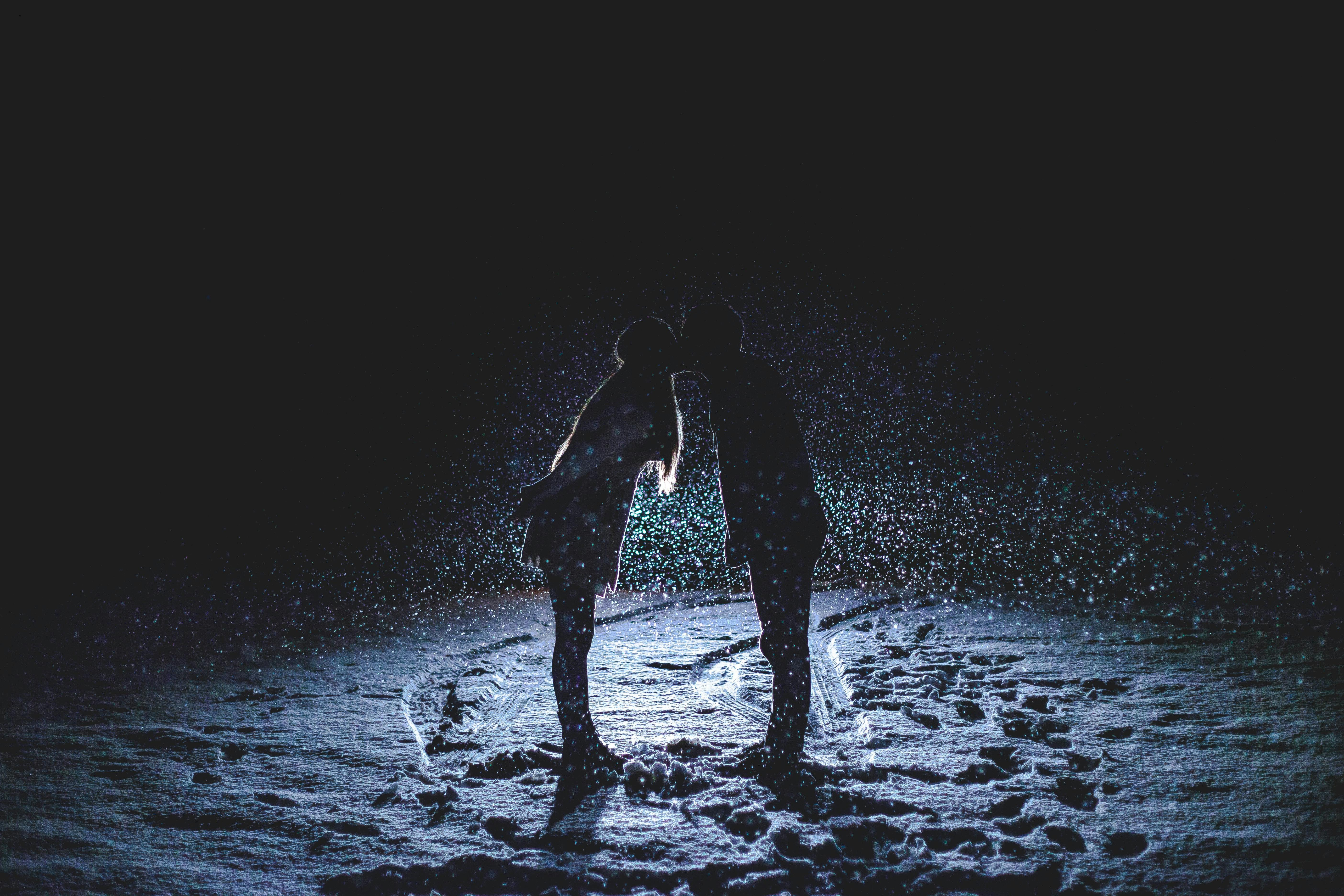 Couple Kissing on Snowfield at Night · Free Stock Photo