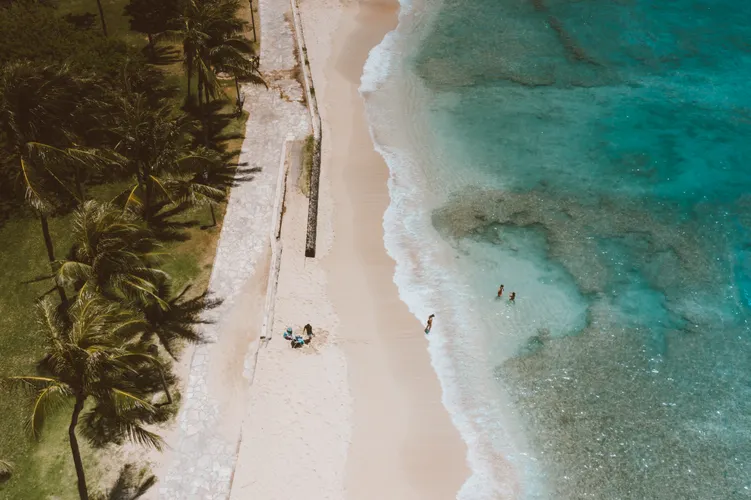 Aerial view of a turquoise tropical beach in Hawaii