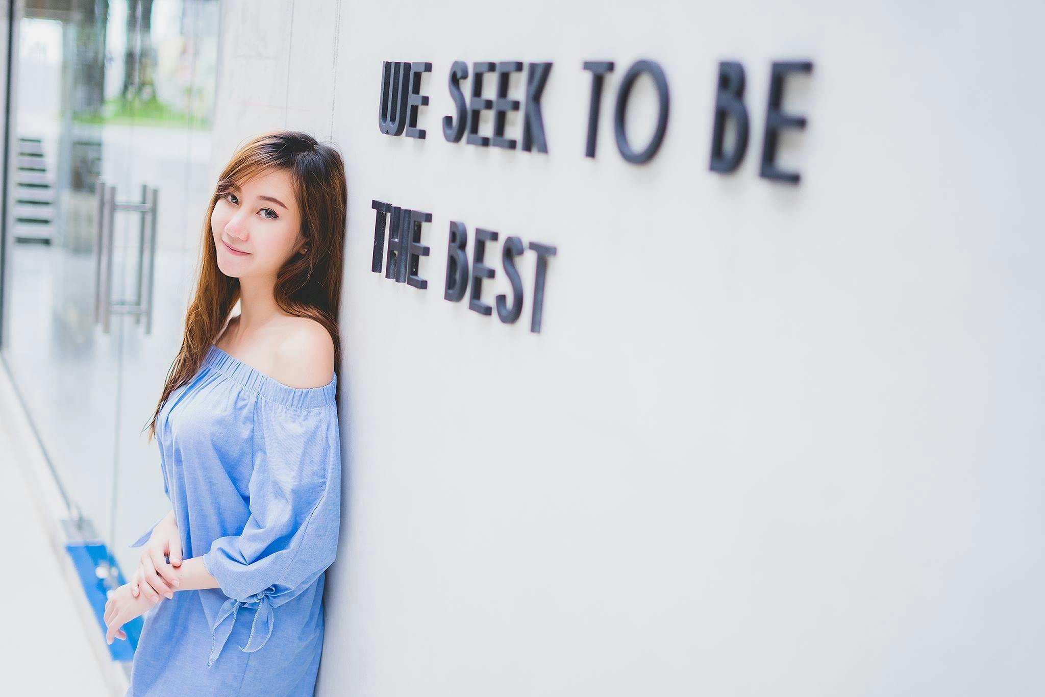 Woman In Blue Dress Lean On The Wall Free Stock Photo