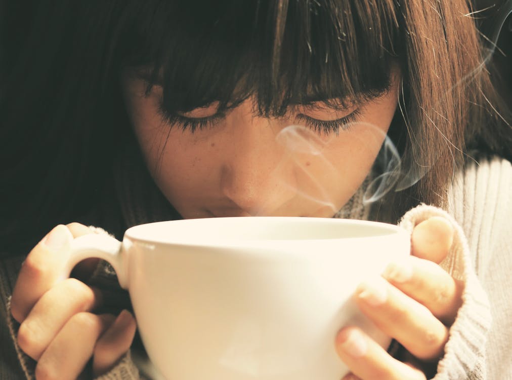 Free Woman Holding White Cup Stock Photo