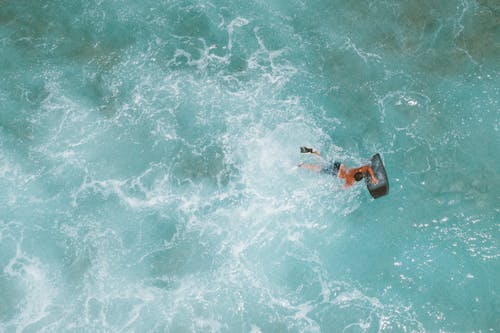 A Person Swimming in the Sea Water