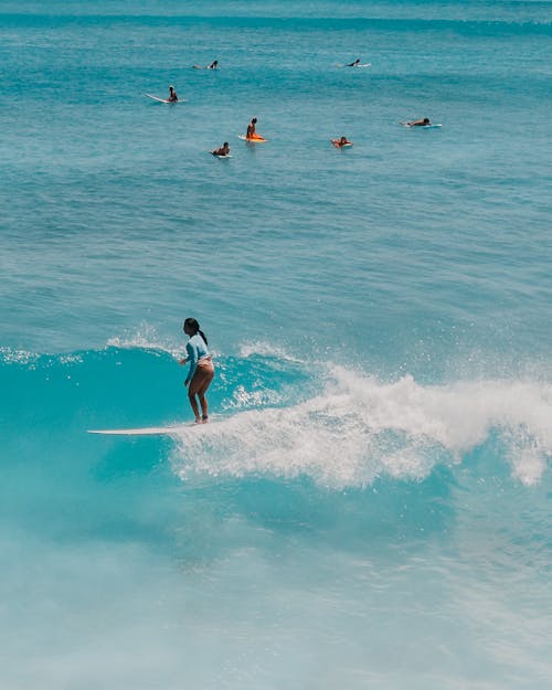 Free Woman in Black Bikini Surfing on Sea Waves Stock Photo