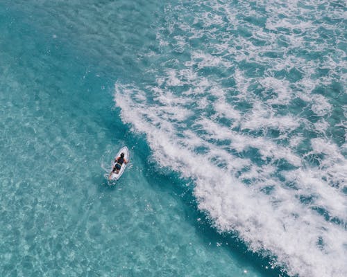 White and Black Boat on Sea