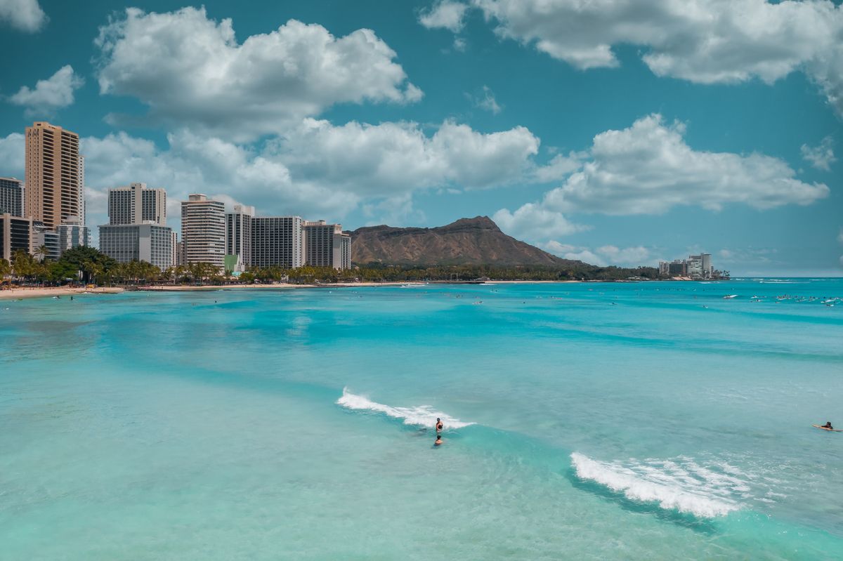 Waikiki Beach with Diamond Head rising behind the hotel-lined shore, Oahu
