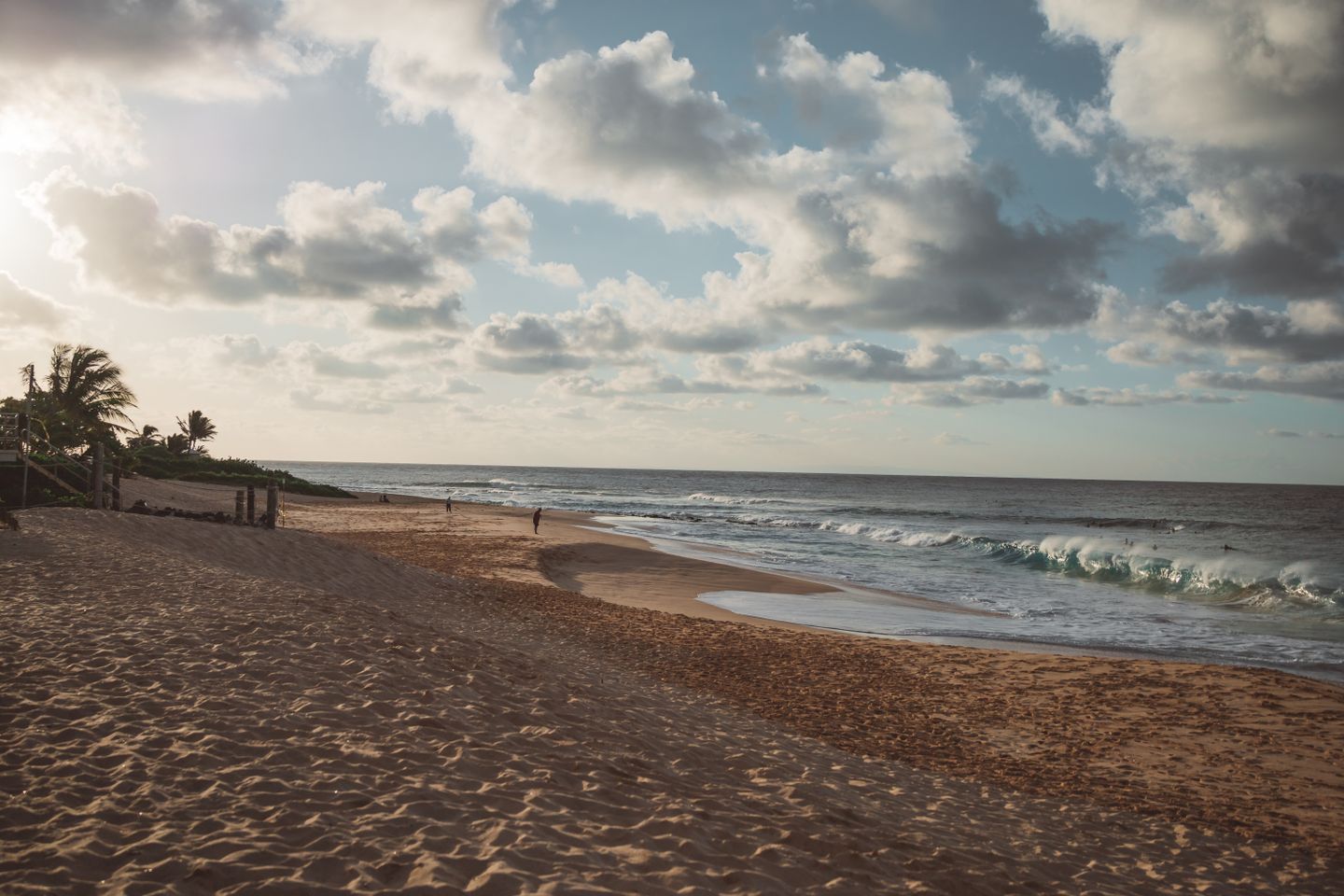 Calm morning light on a Hawaiian beach with gentle surf