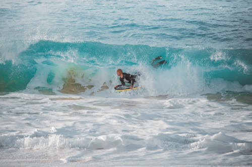 Man Surfing on Sea Waves