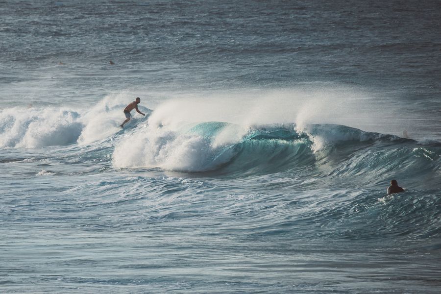 Surfer riding powerful ocean waves