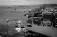 Cargo ship floating on spacious river