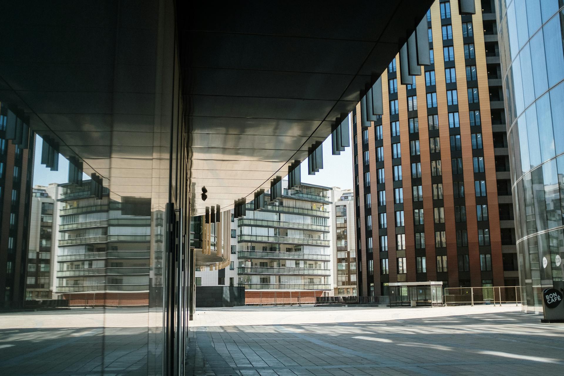 Contemporary cityscape featuring reflective office buildings in an empty urban center.