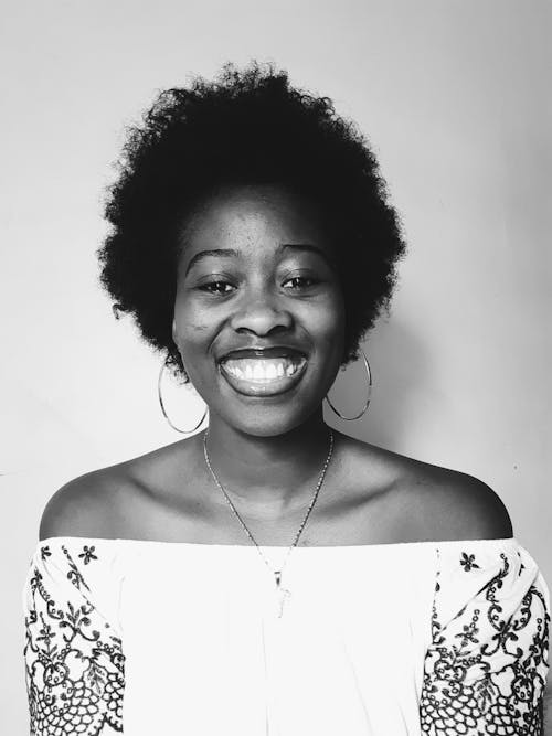 Free A Woman Wearing an Off Shoulder Top  Stock Photo