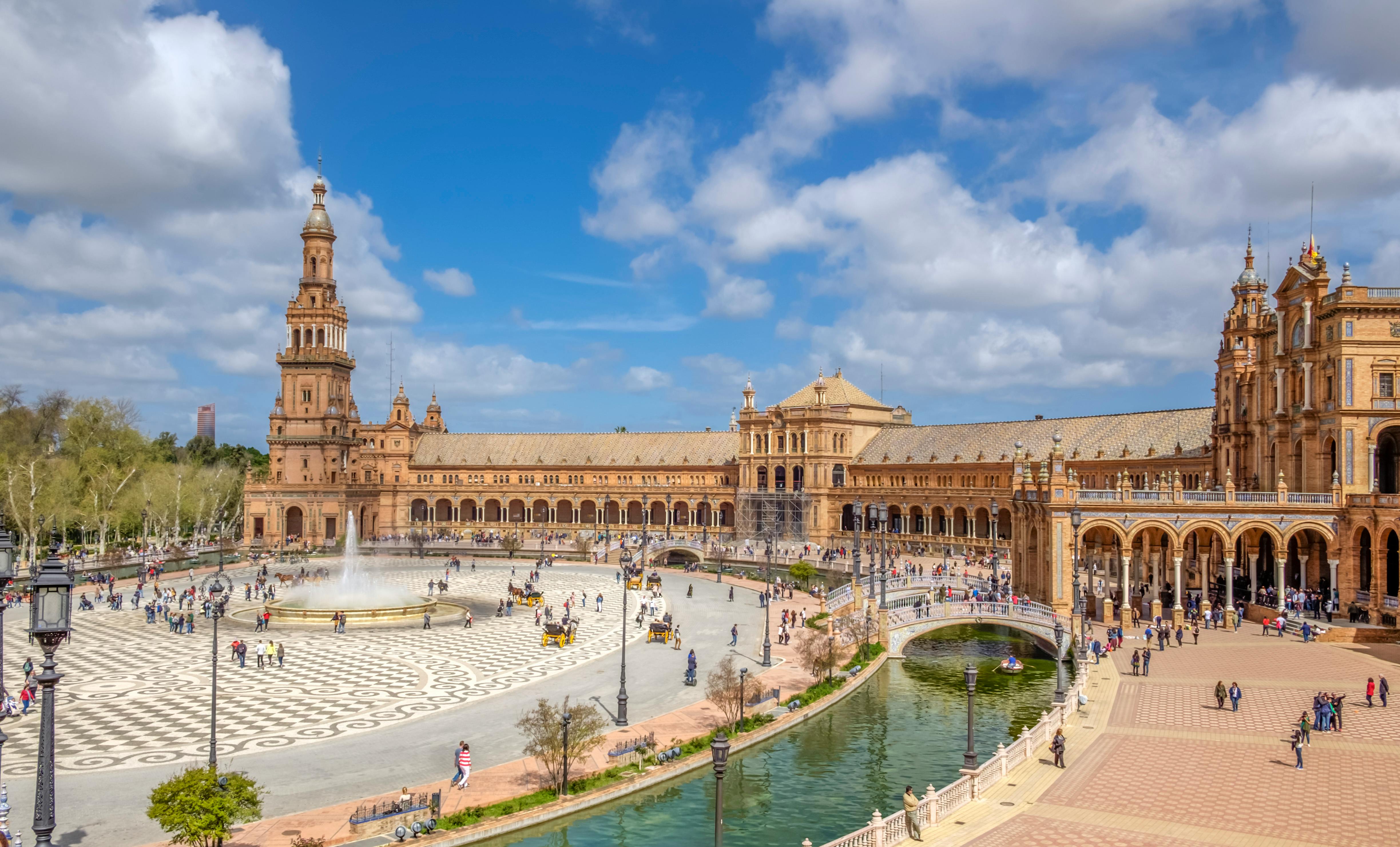 scenic view of spain square under blue sky with white clouds at daytime