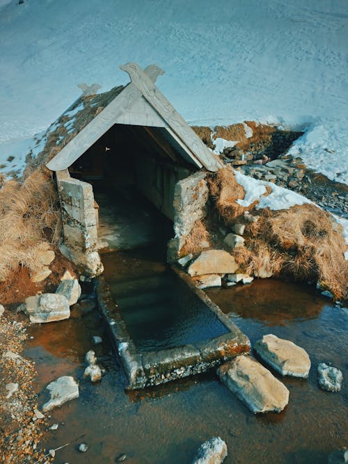 Entrance to pit house filled with water