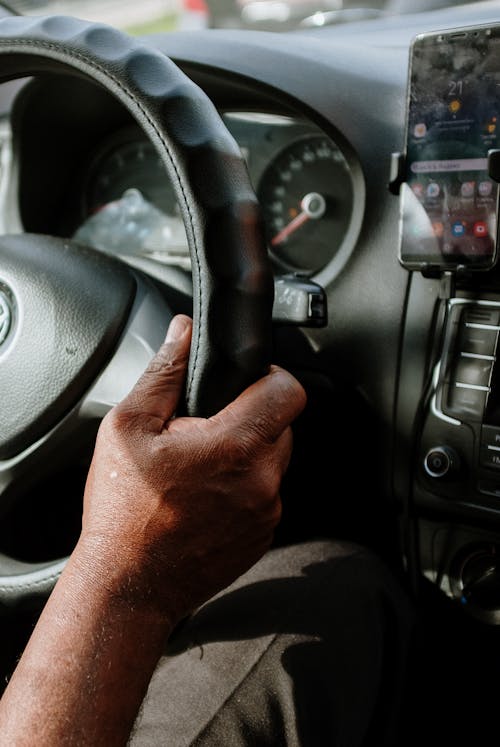 Person Holding Black Steering Wheel