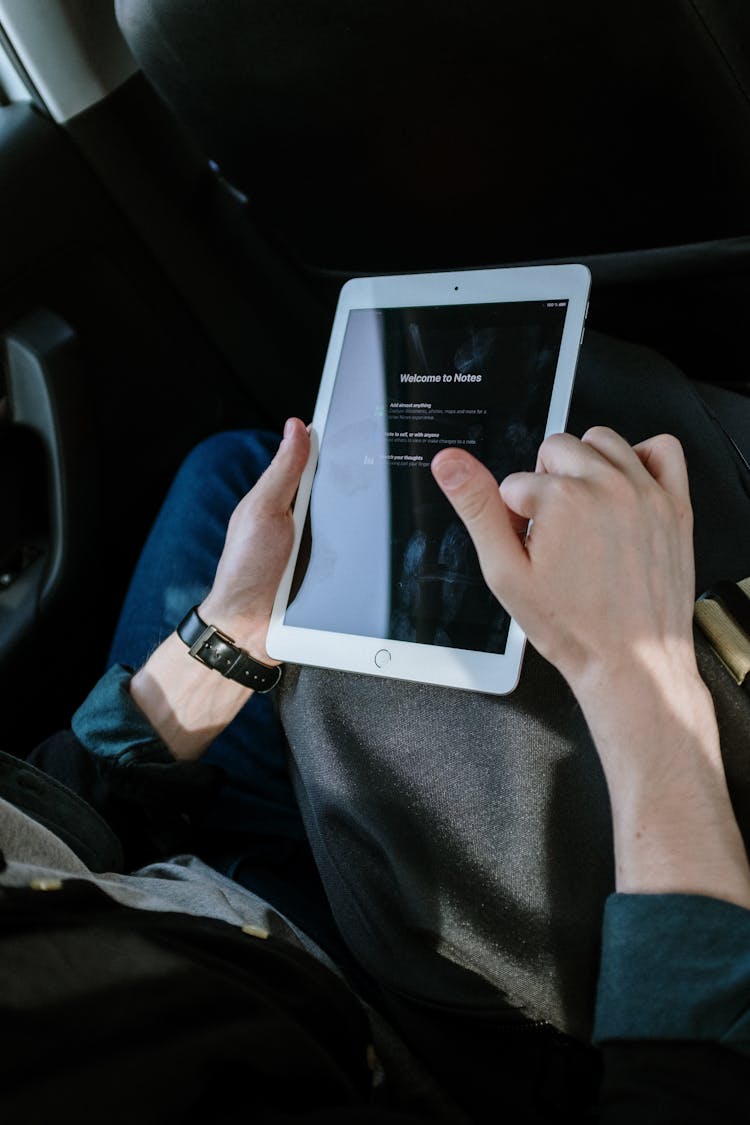 Person Holding White Ipad Mini