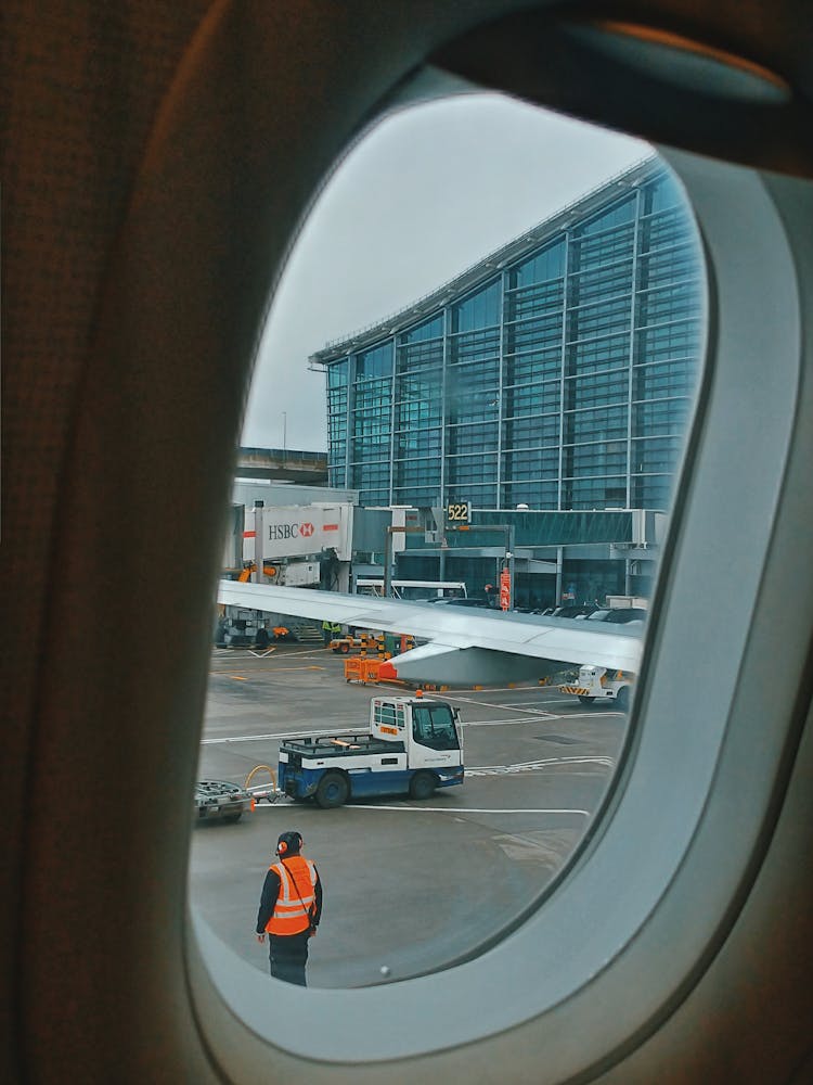 Airport Through Window Of Plane