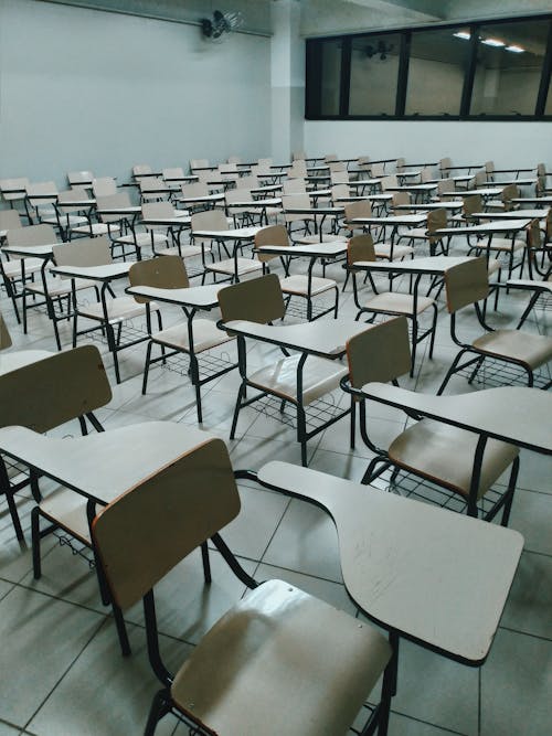 Rows of identical desks in school