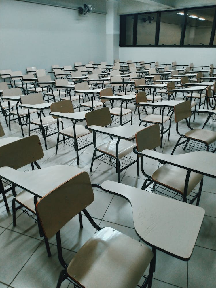 Rows Of Identical Desks In School