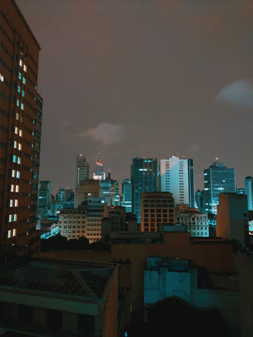 Cityscape of modern skyscrapers and night sky