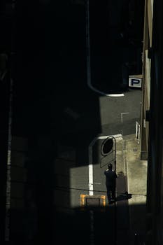 Dramatic cityscape with striking shadows in a Tokyo street.