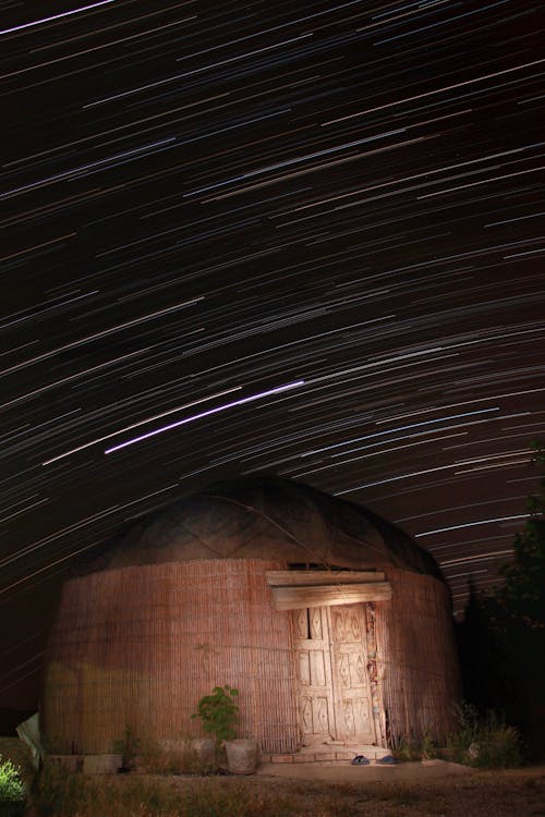 Free  Round House under a Starry Sky in Time Lapse Photography Stock Photo