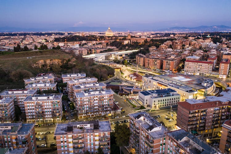 Cityscape With Residential Buildings And Busy Streets During Sundown