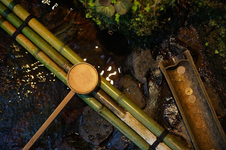 Bamboo Water Pipes With Dipper Near Brook