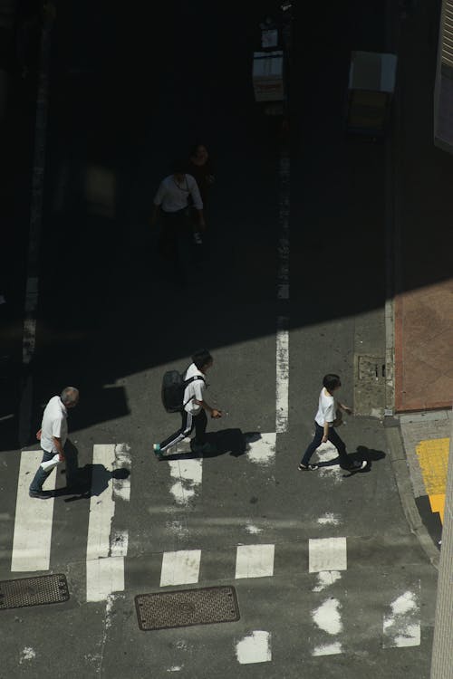 People Walking and Crossing the Street