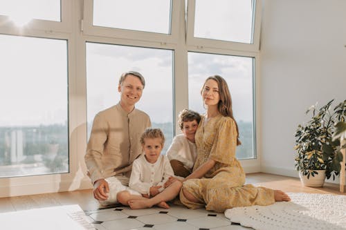A Family Sitting on the Floor
