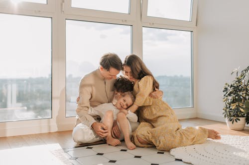 A Family Sitting on the Floor