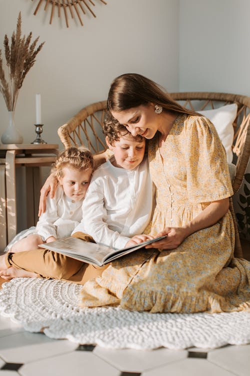 Mother and Her Children Sitting on the Floor