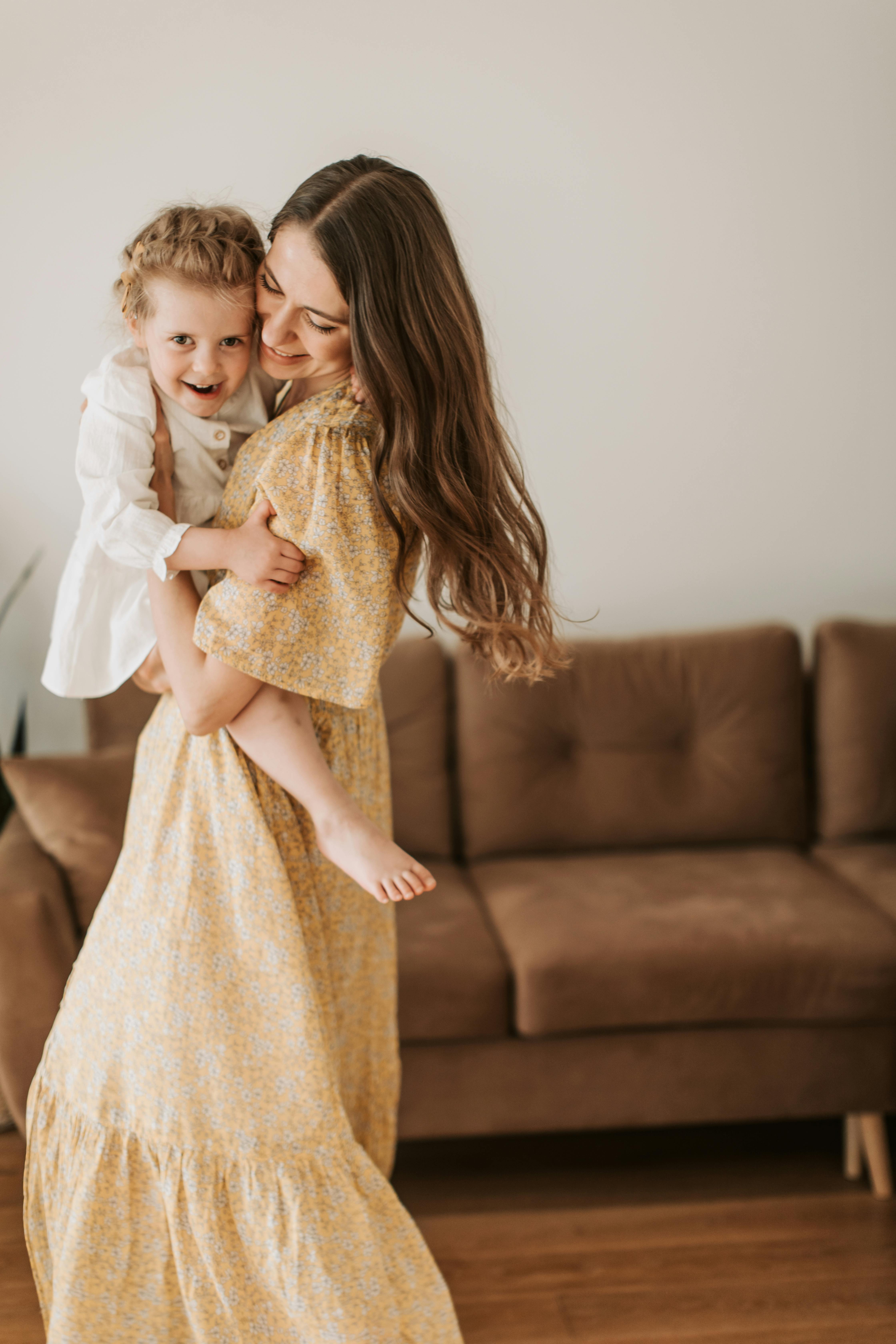 a woman carrying a child