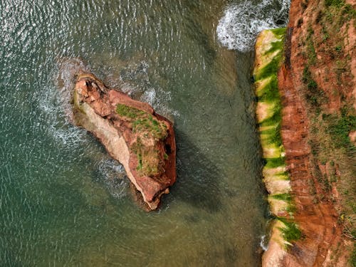 Aerial View of Rock Formation on Ocean