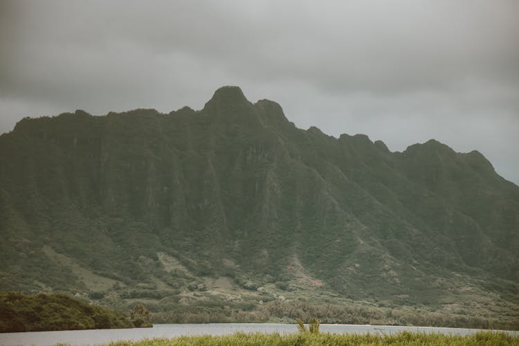 Green Mountain Under Thick Clouds