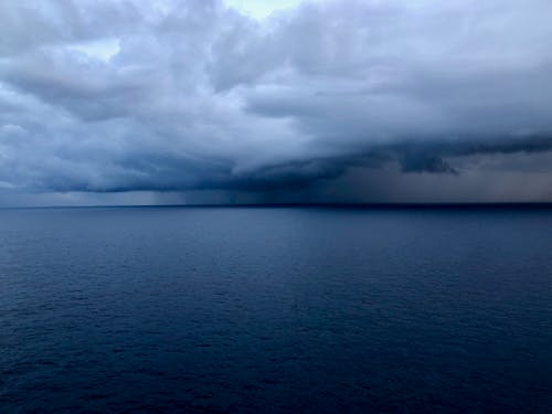 Foto profissional grátis de mar, nuvens de chuva, oceano