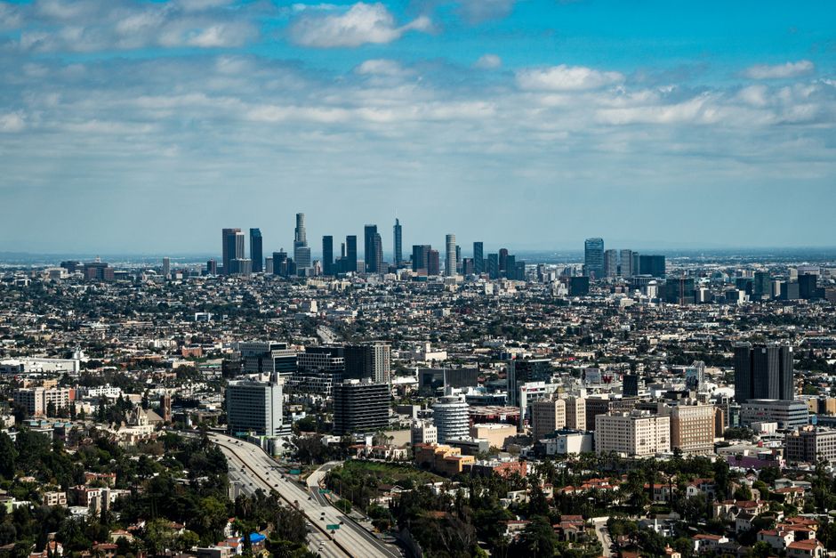 Spectacular Los Angeles Hollywood Sign & City Tour by Helicopter Review 2026 - Stunning aerial view of Los Angeles skyline with skyscrapers under a blue sky.