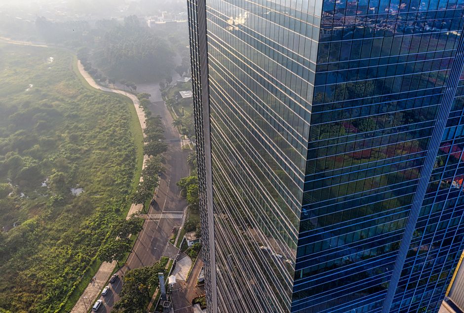 Aerial view of Gurgaon Cyber City Grade-A commercial office towers at golden hour representing pre-leased property investment opportunities