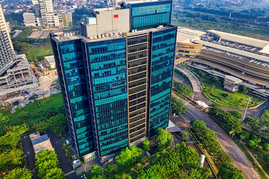 Aerial shot of a modern skyscraper in Banten, Indonesia showcasing urban architecture.