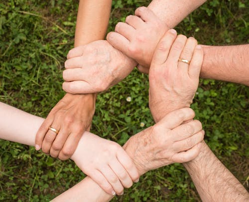 Free Group of People Holding Arms Stock Photo