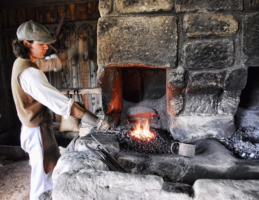 Man Holding Gray Tong over Fire